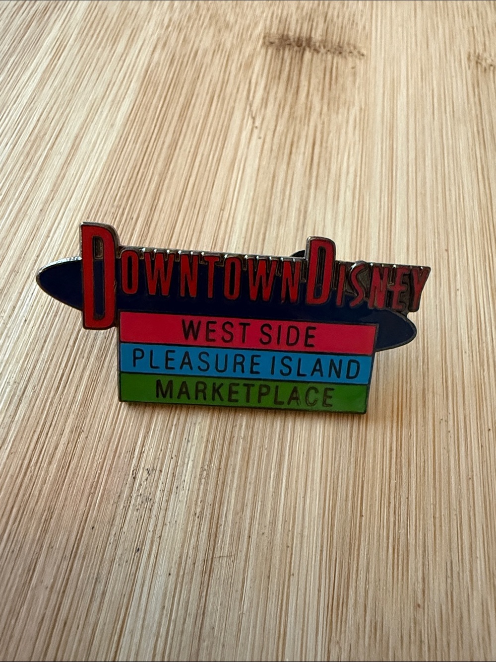 West Side Pleasure Island Marketplace Enamel Pin - Red/Blue/Green